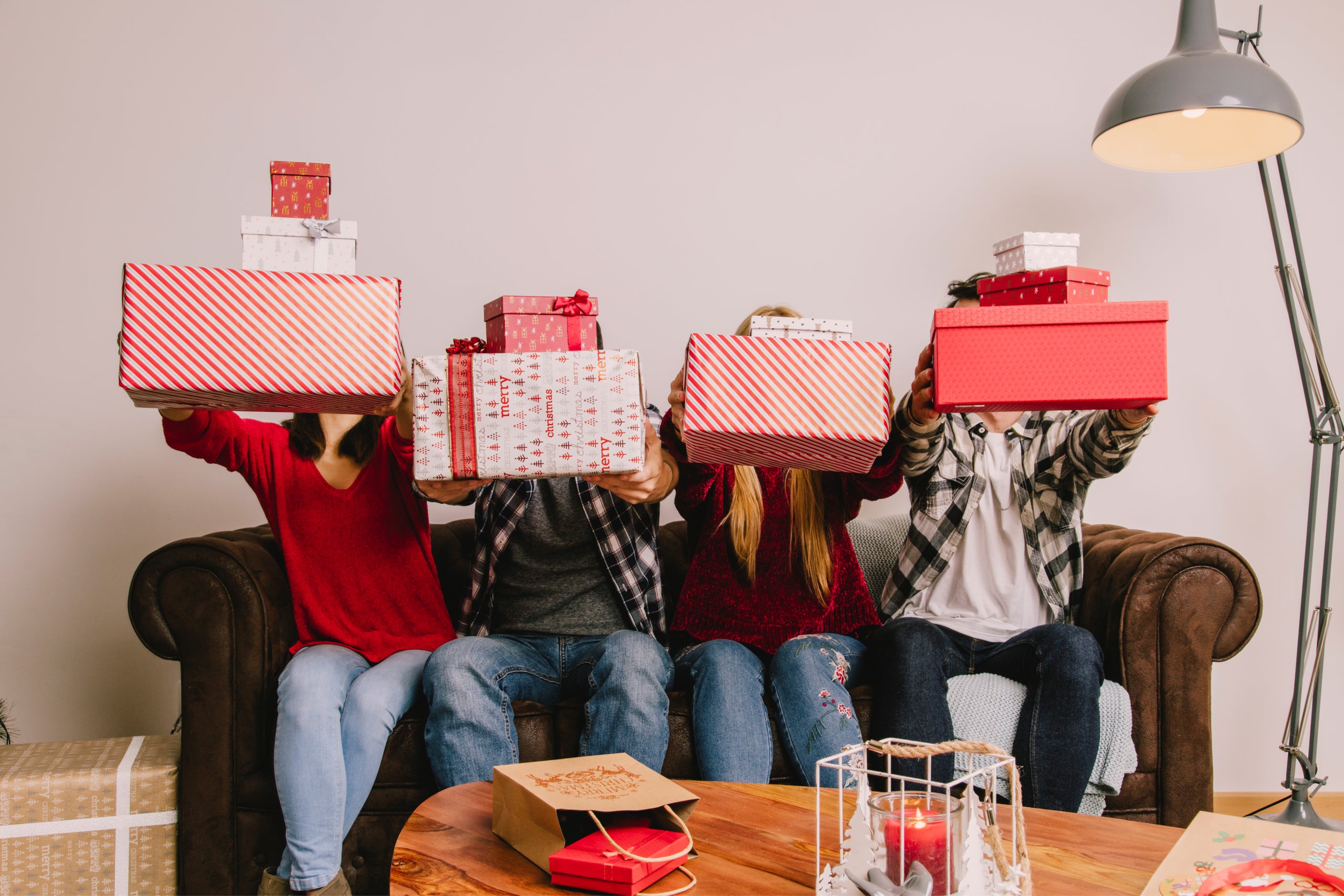 Friends on couch gifting each other