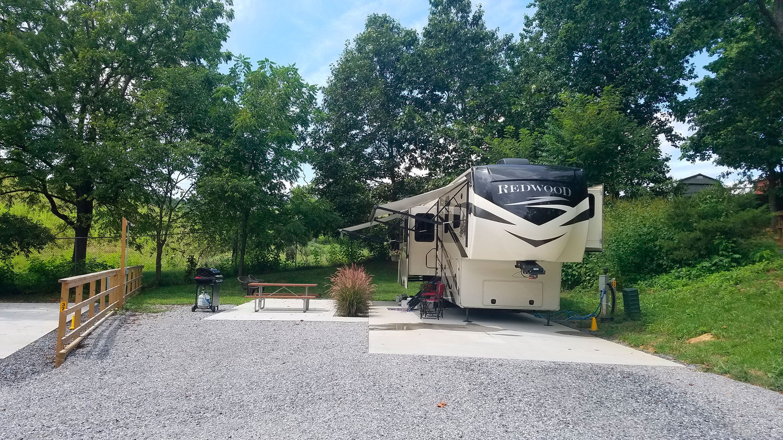  Rv motor home is parked at a campsite rv park