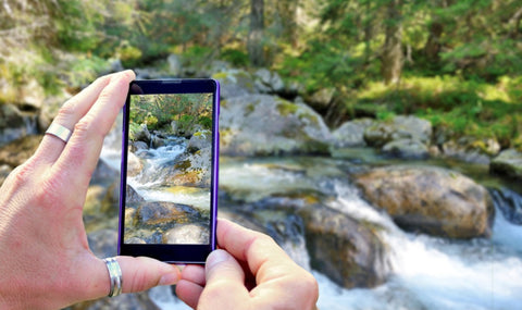 man-takes-photo-of-nature-with-phone