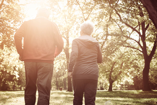 Active seniors walking in woods