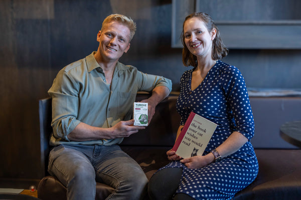 Dr Scott and Lucy Hoile holding a pack of YuMOVE Joint Care PLUS for Cats