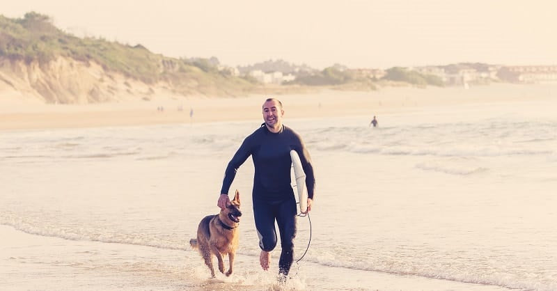 Surfer with his dog