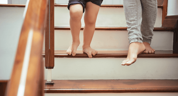woman and child walking down stairs