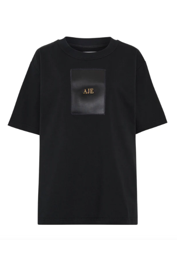 The Avi Tee Smiley by Anine Bing is an oversized, boxy T-shirt constructed  from lightweight jersey in a vintage black wash. It features a