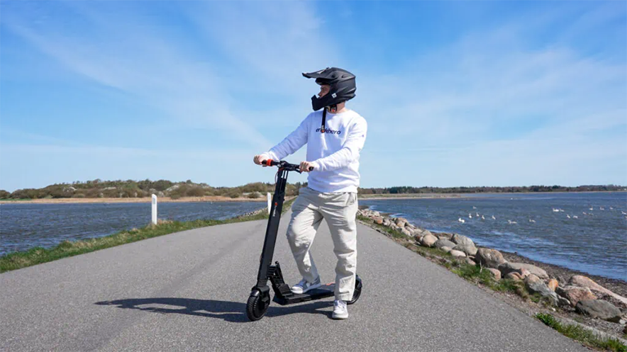 Man with the TurboAnt V8 electric scooter