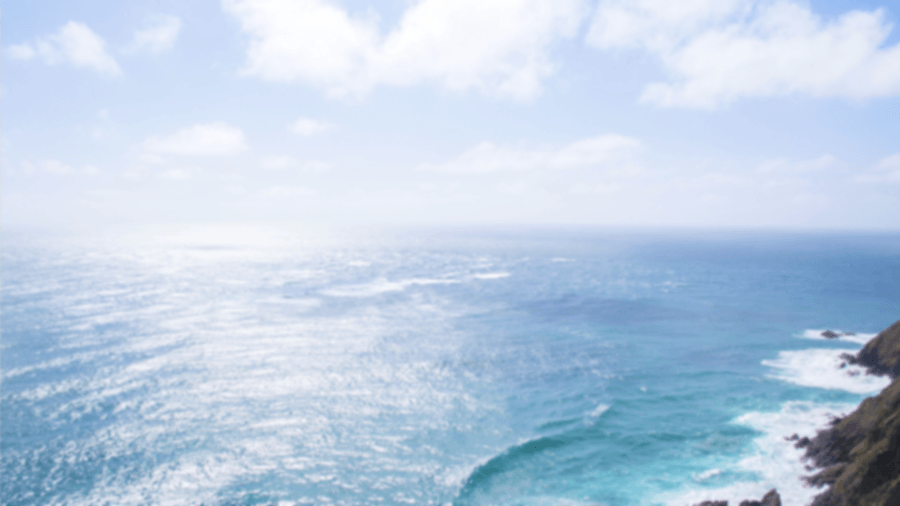 Blurred view of the ocean with plenty of glare from reflected light