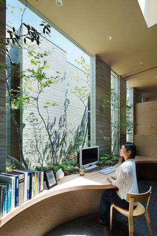Desk set in front of a large window to maximise productivity & creativity