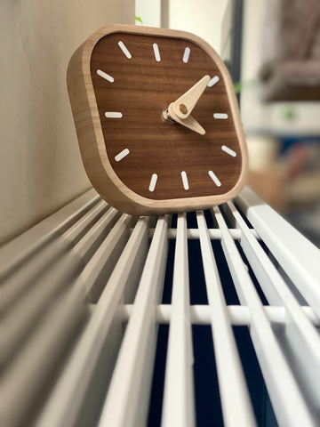 Thin analogue clock made of wood