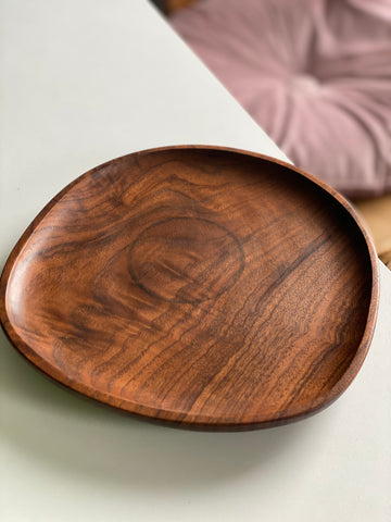 Water stain on a round black walnut plate