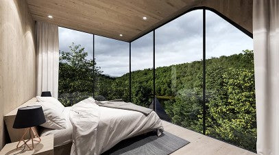panoramic view of forest from luxurious treehouse bedroom
