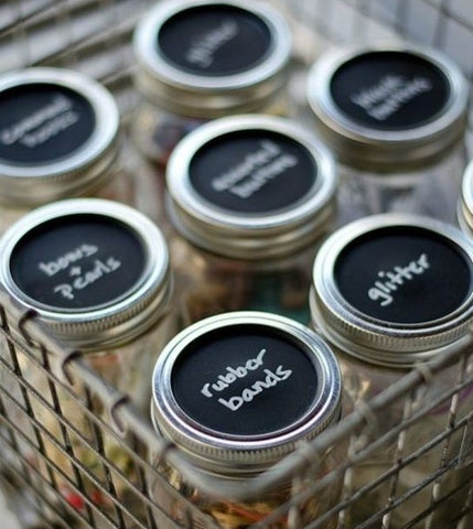 art and craft supply storage and organisation in glass jars