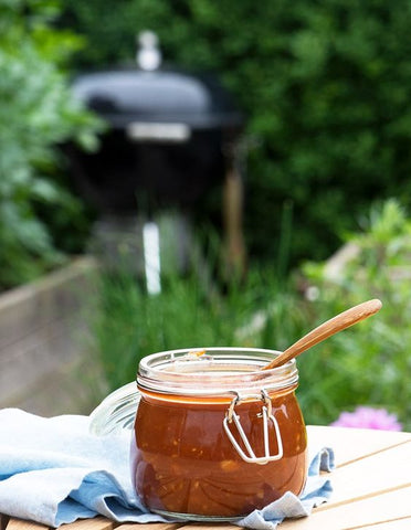 outdoors shot of marinade in a small glass jar 