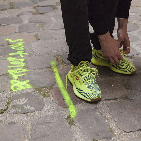 semi frozen yellow yeezys on feet