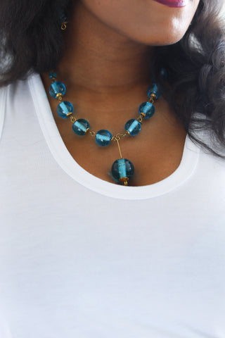 A bold statement necklace made from recycled glass. A true work of art.