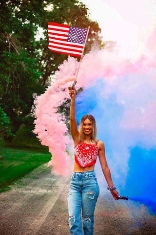 Girl with an American Flag and Smoke Bombs in Red and Blue