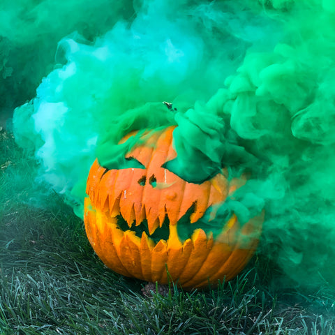 Green Smoke Plumes wafting from a carved pumpkin for a halloween photoshoot