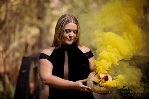 girl with smoking yellow pumpkin