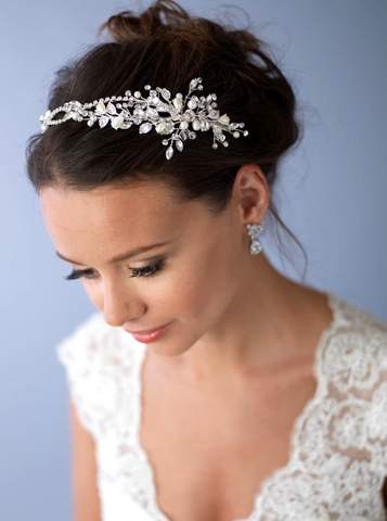 Bridal headband crystals and flowers with pearls from one side of the hair