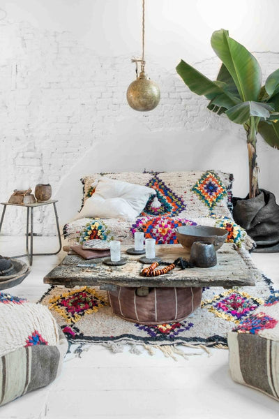 Boho style colorful rug and deco, photo by Paulina Arcklin