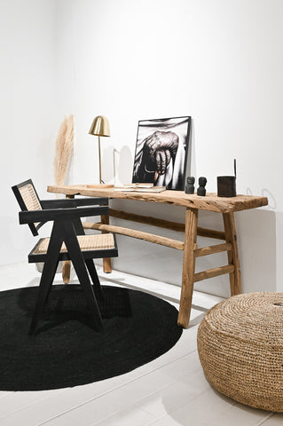 Ethnic Boho style home office with rustic wooden office table and classic teak cane chair from Zoco Home