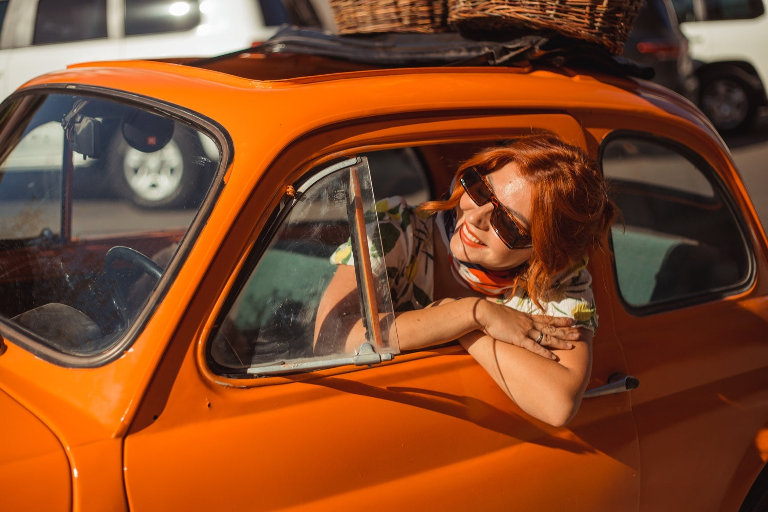 A Comprehensive Guide to Renting a Car in Italy with a US License, Woman in a car window, International driver's License, Italy
