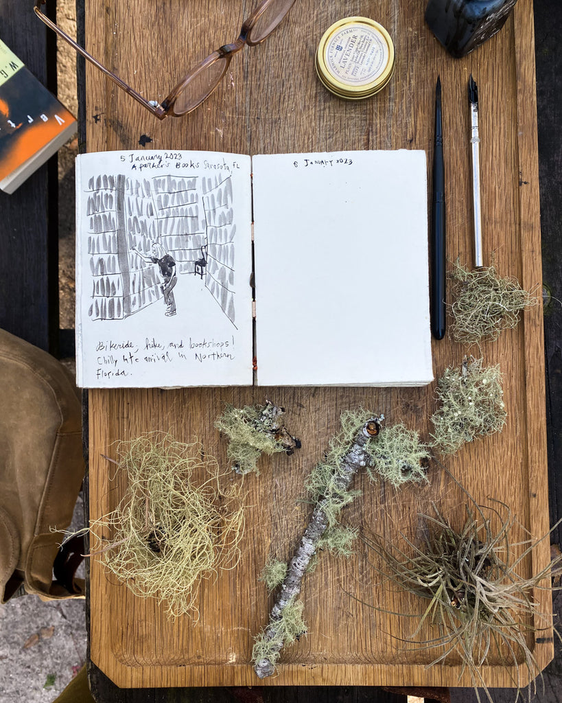 Handmade sketchbook with drawing of person hiking