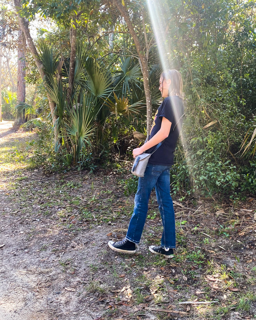 Søren wearing a small hunter satchel while walking in the forest