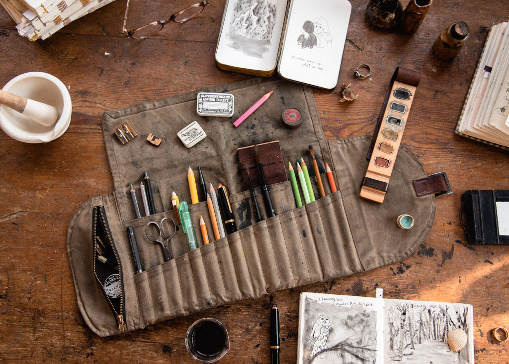 waxed canvas sendak artist roll with paintbrushes and other art supplies