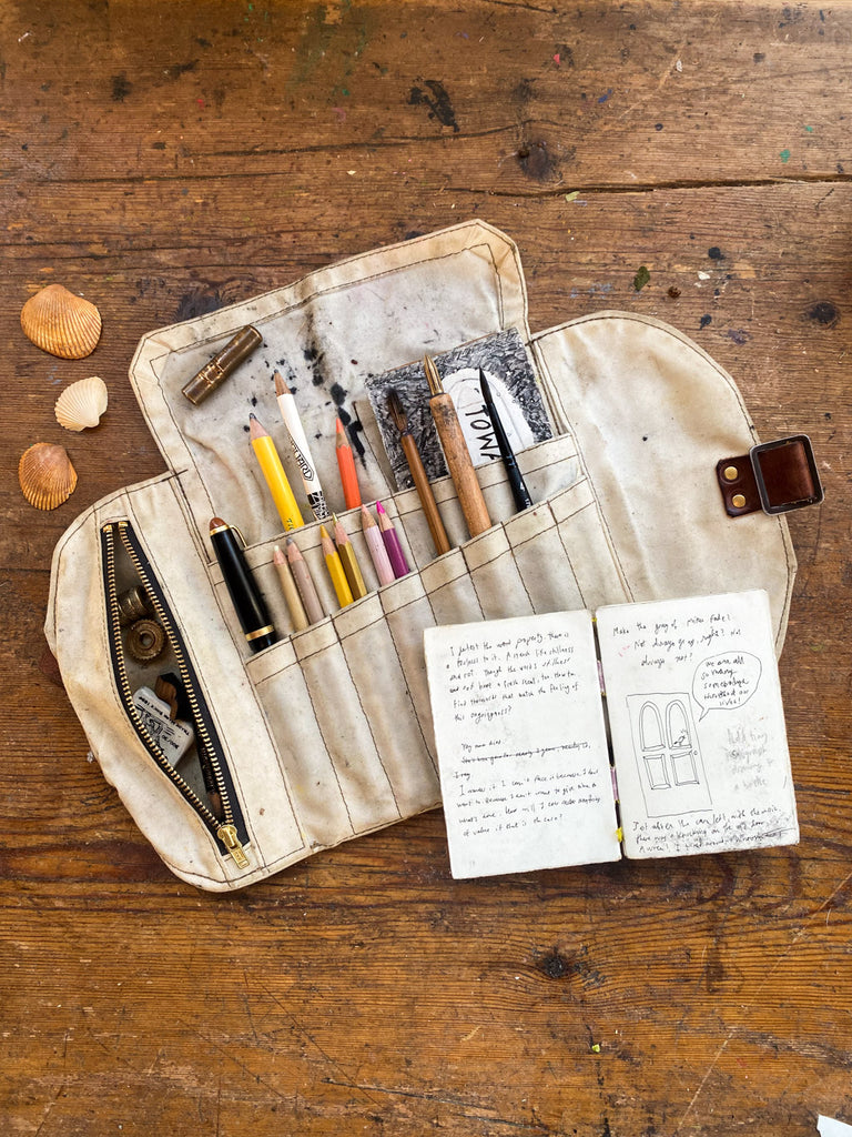 waxed canvas roll up pencil case with essential writing and drawing supplies