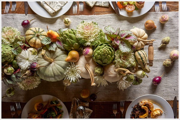 Tablescape with autumn harvest vegetables.