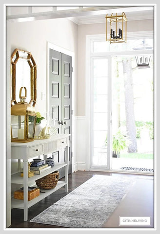 Brass lantern on entryway table 