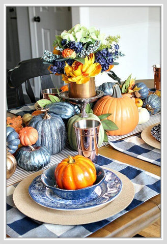 Table set with pumpkins and fall flowers