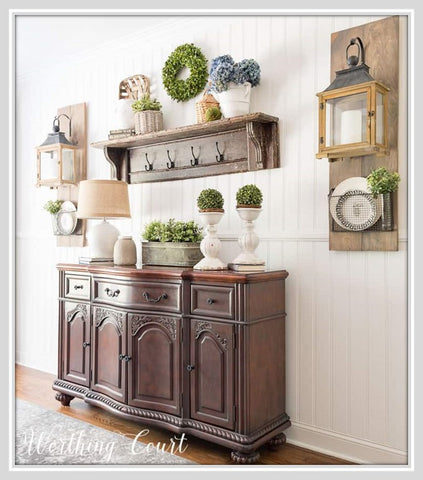 Hanging lanterns on either side of dining room sideboard