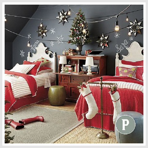 Festively decorated children's bedroom with Christmas socks, twinkling stars, and a beautifully adorned Christmas tree.