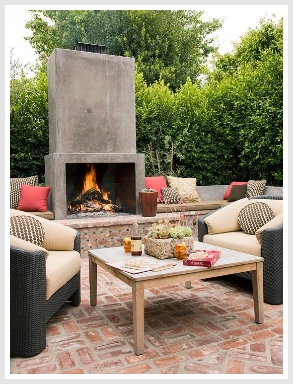 Outdoor living fireplace with seating area.