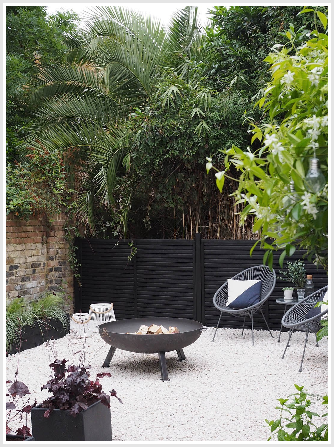 Contemporary London garden with outdoor furniture and plants.