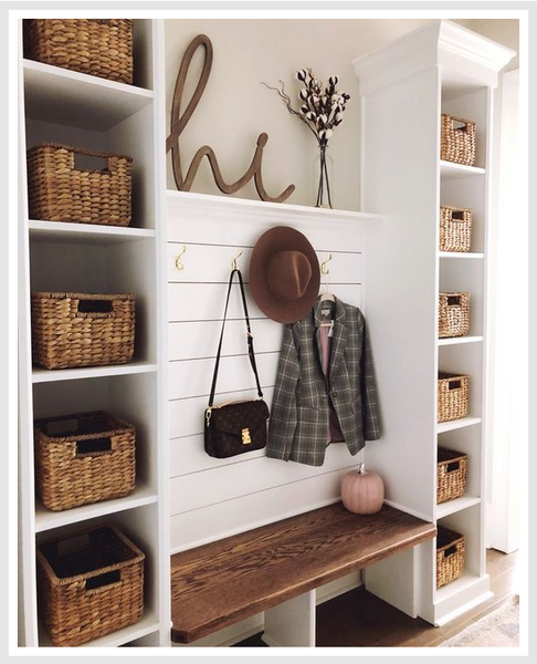 Cubby shelves with baskets in foyer.