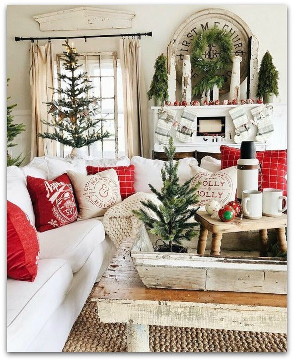 A sofa with Christmas pillows and decor.