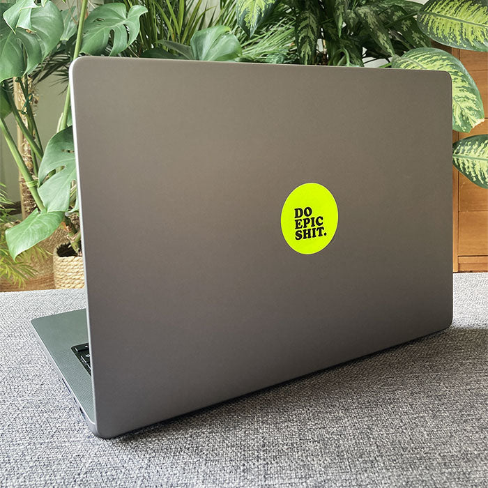 macbook with neon yellow adhesive-free sticker