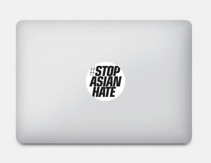 macbook with sticker black lives matter and stop asian hate 