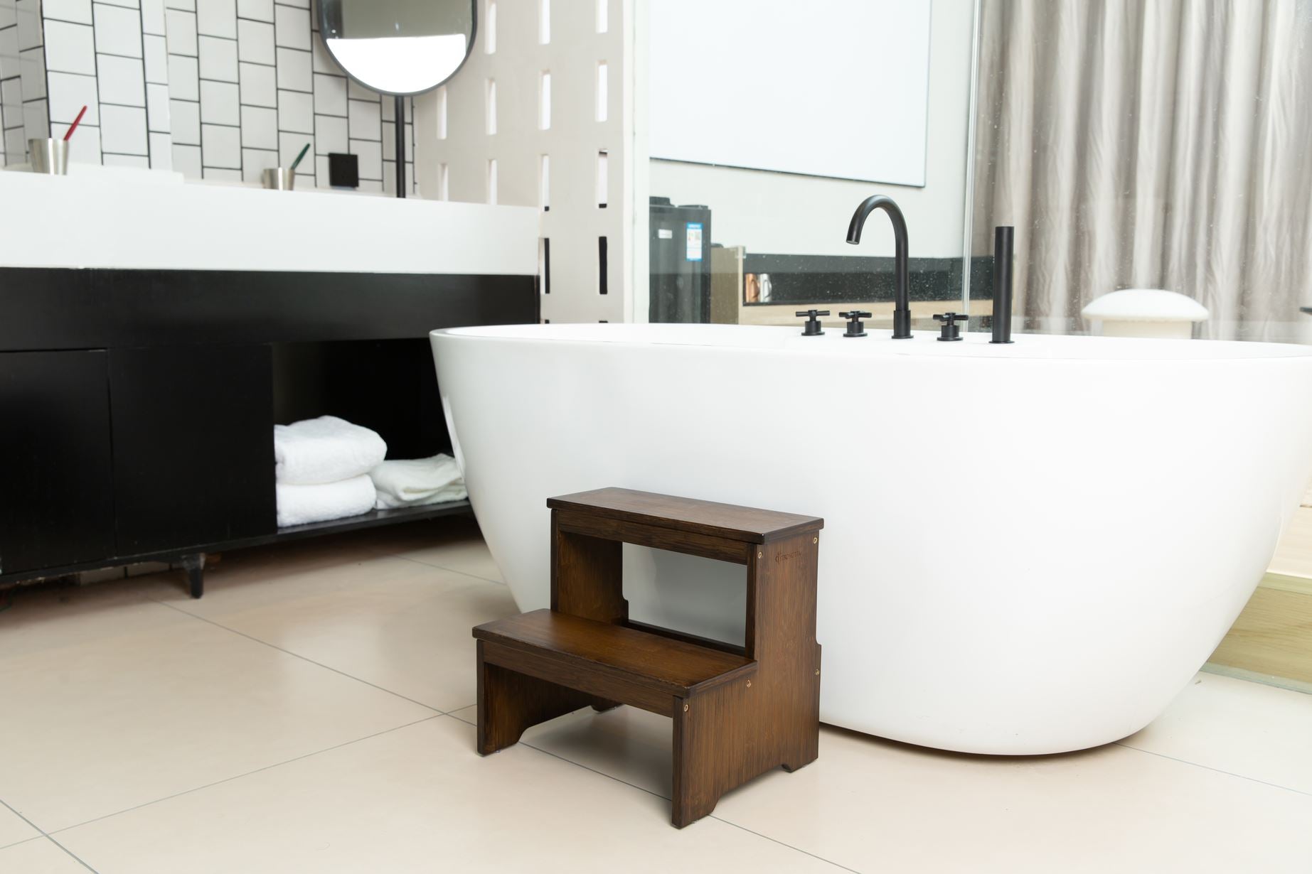 a wood step stool used in the bathroom