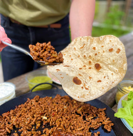 Loading tortilla wraps with beef chilli