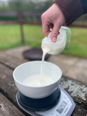adding milk to the yeast mixture
