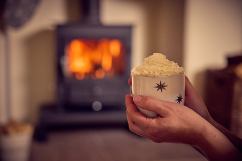 Winter hot chocolate next to a woodburner