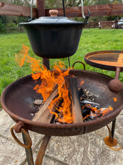 cooking stew a firepit with a kotlcih