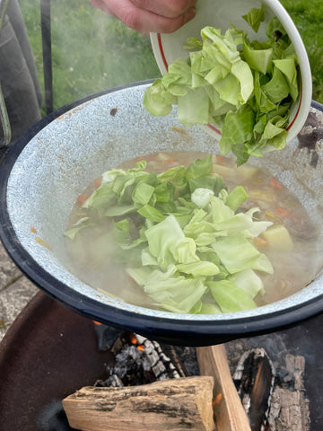 adding cabbage to contents of irish stew