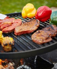 cooking meat and vegtables on a wood fired bbq