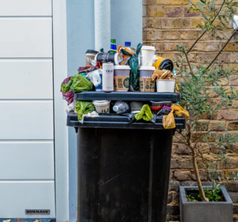 OVERFLOWING RUBBISH FROM FOOD WASTE