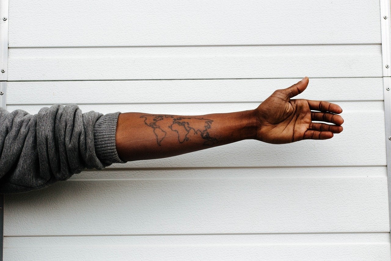 african arm tattoo