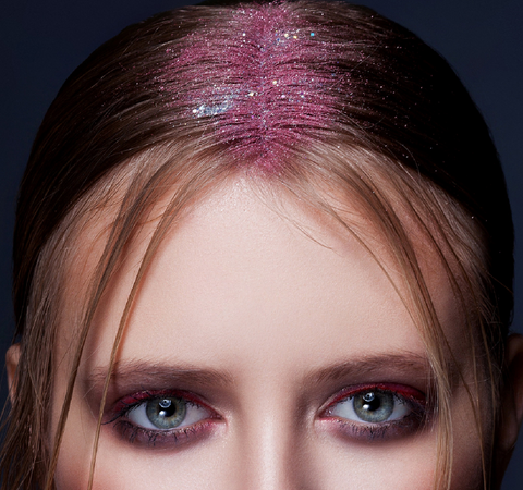 young lady with colorful tinsel in hair